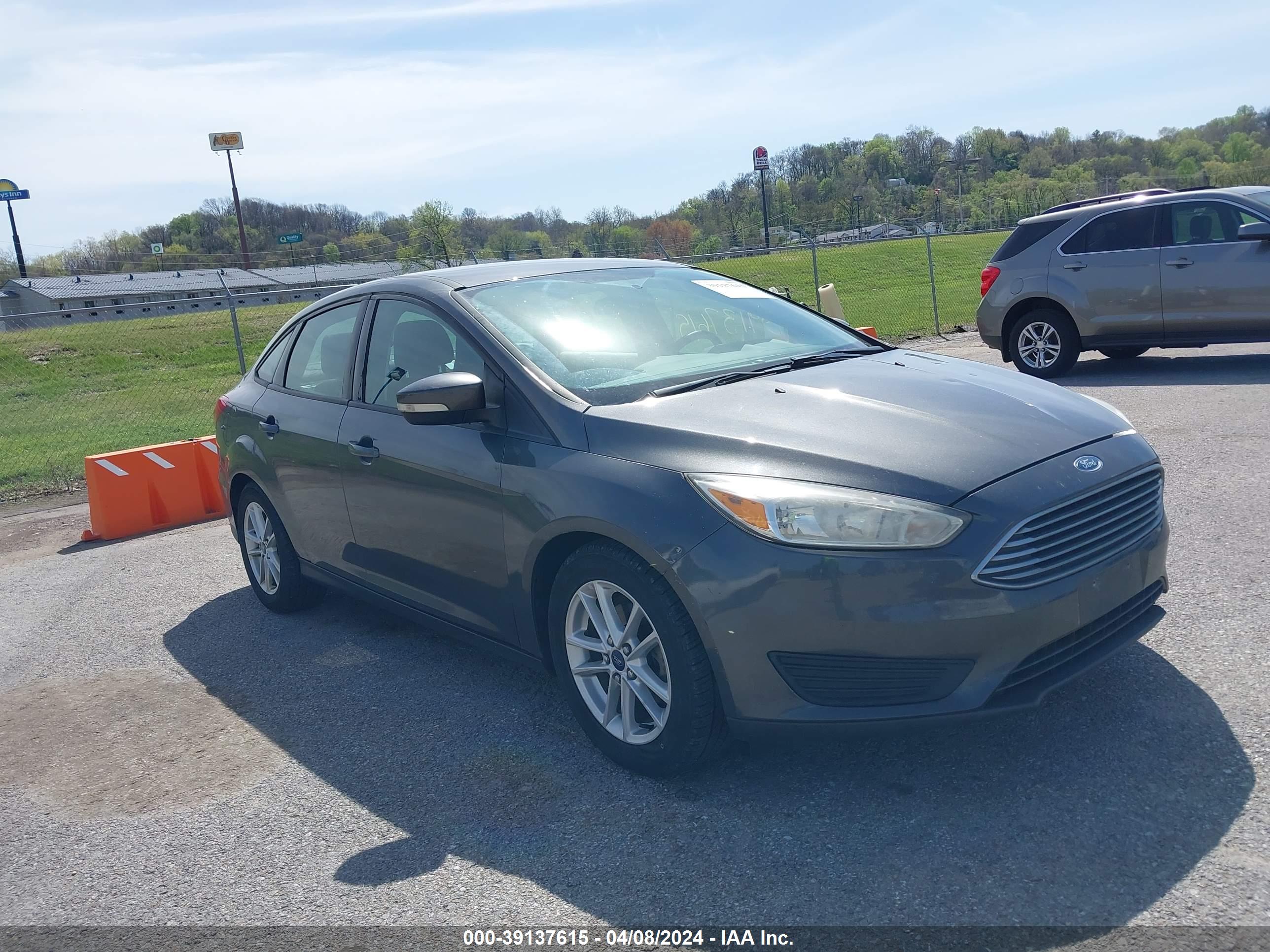 2016 FORD FOCUS — VIN 1FADP3F23GL318331 — photo 1 of 16